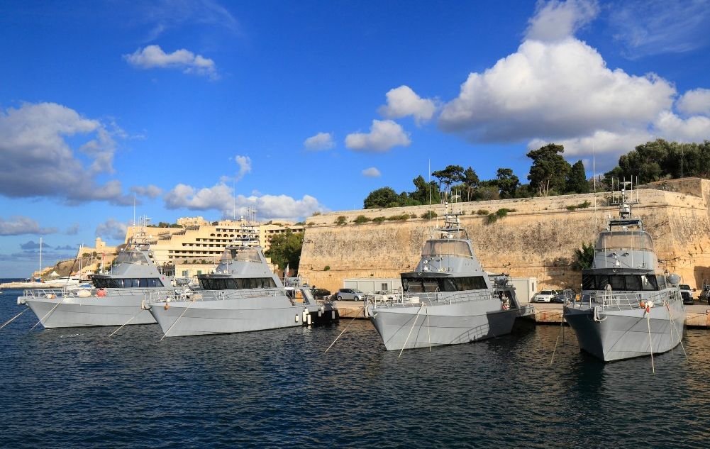 Four patrol boats of the Armed Forces of Malta docked along the Harbour wall
