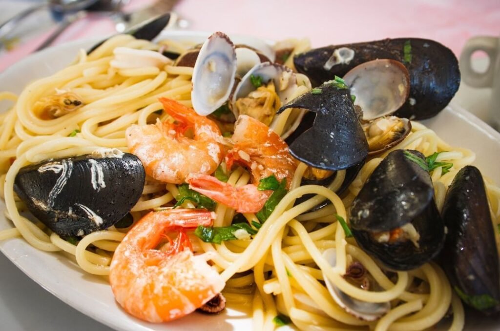 Plate of seafood linguine with prawns, mussels, and clams served in a local Maltese restaurant