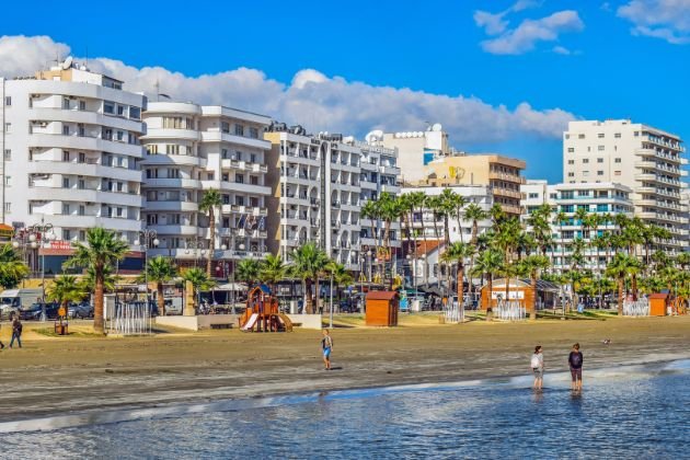 Cyprus travel guide Beachfront hotels and palm trees along the Larnaca seafront promenade