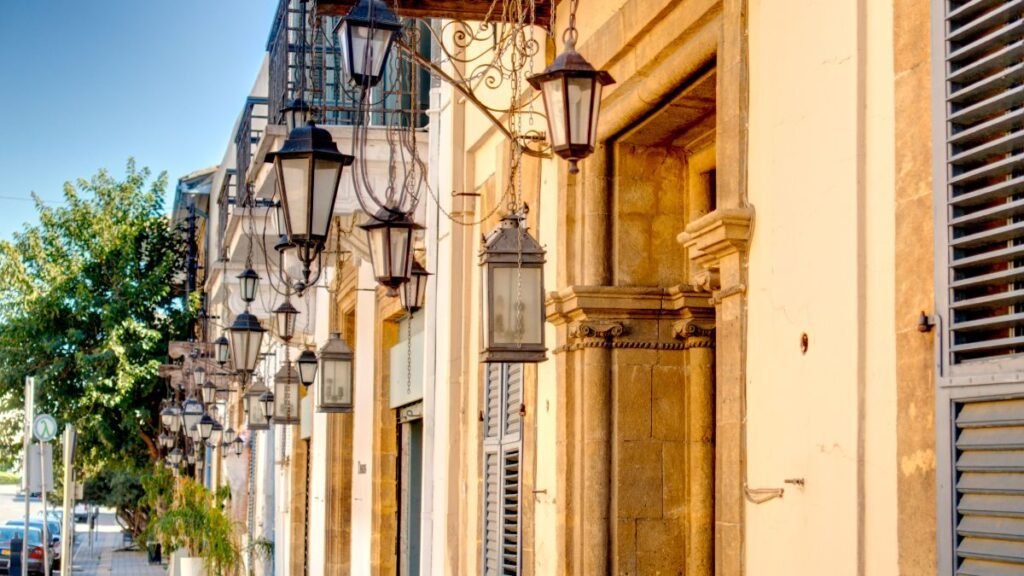 Row of lanterns and historic sandstone buildings in Nicosia Old Town, Cyprus